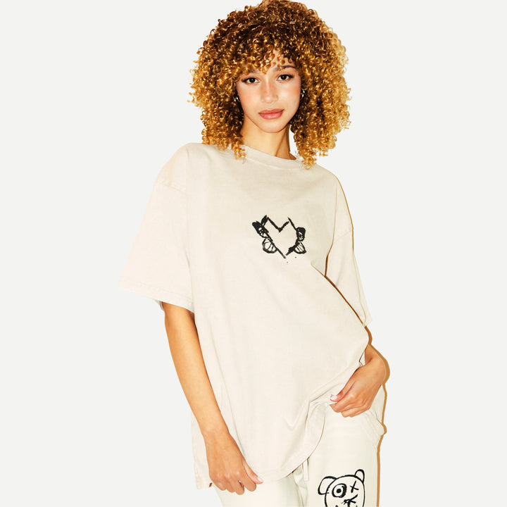 Hearts Evolve | Universal Apricot Tee